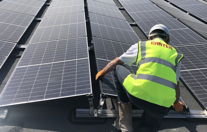 construction worker and solar panels 